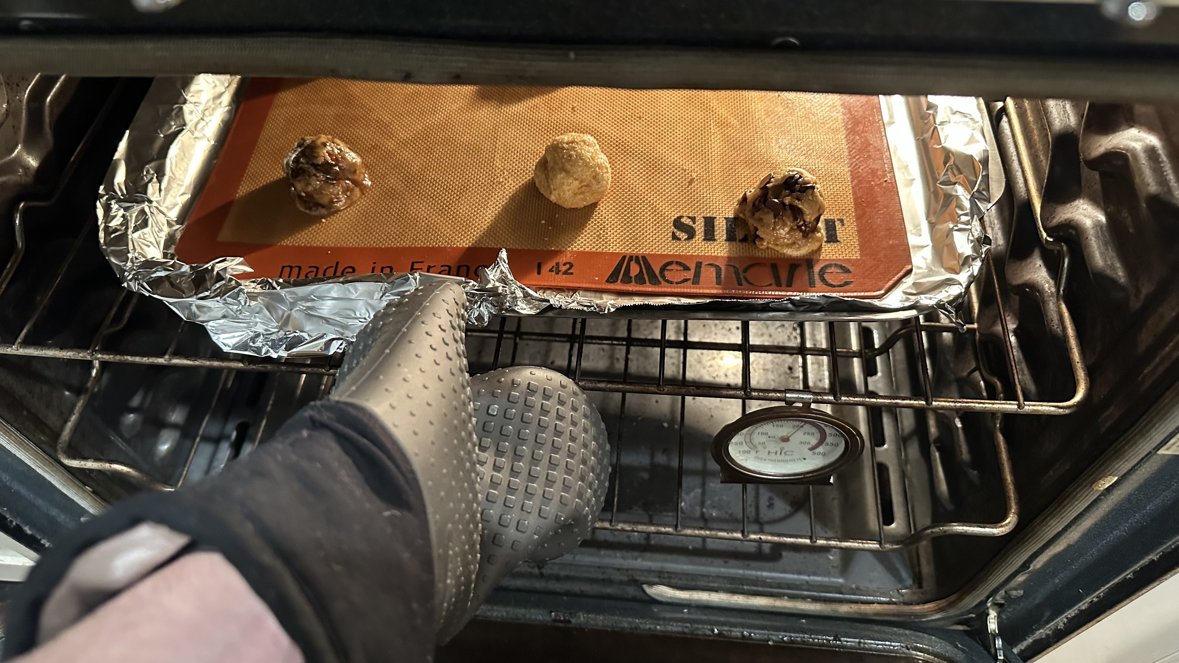 Putting cookies in oven